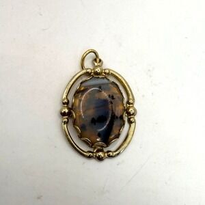 Vintage Gold Tone Oval Pendant Brown Black Cabochon Stone Open Frame Charm